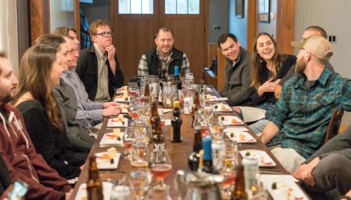 friends having dinner as an example of how to meet new neighbors after moving locally in LA or make a move in party