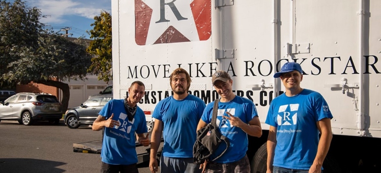 Long distance movers San Francisco standing in front of the moving truck