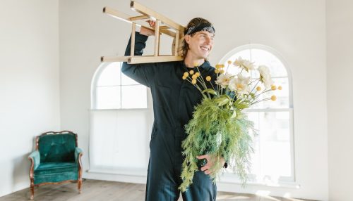 a man holding moving boxes