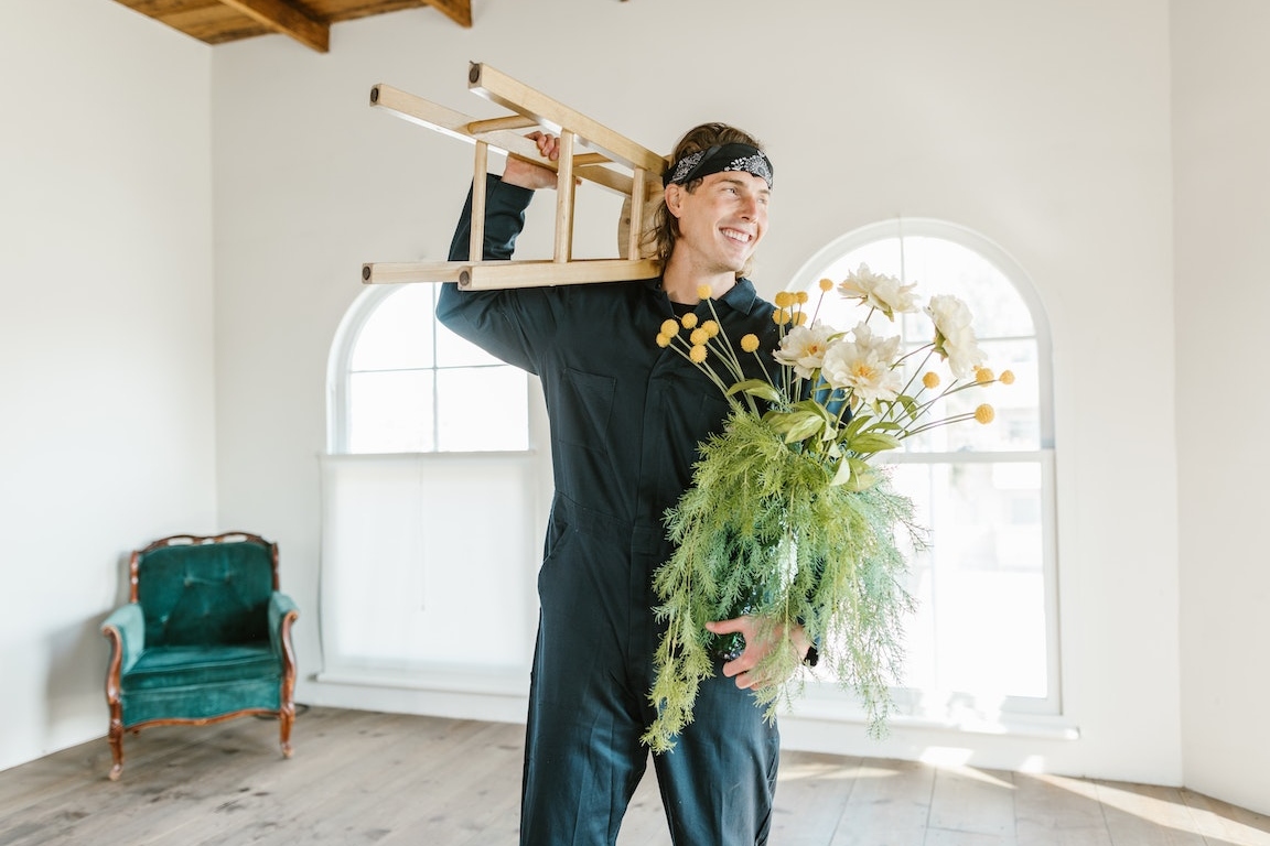 a man holding moving boxes