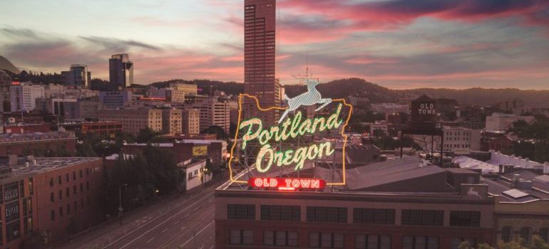 An image of a sign saying 'Portland, Oregon'.