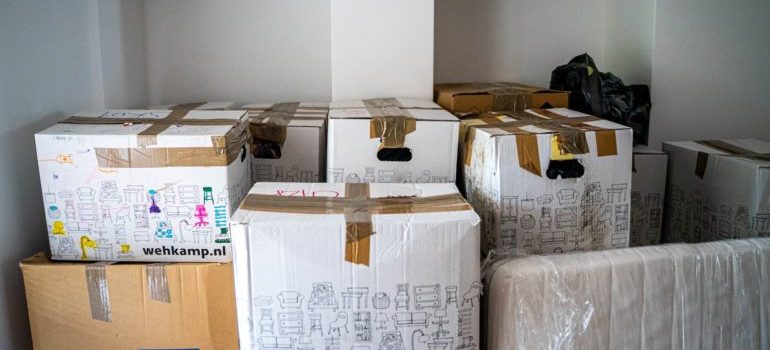Lots of packed moving boxes, as you prepare for relocating your business from Phoenix to Portland.