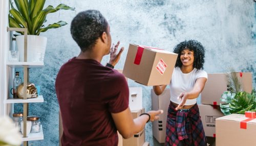 smiling couple having fun while moving