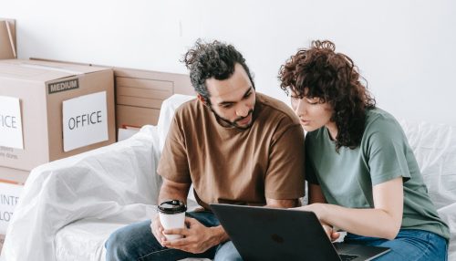 A couple using a laptop