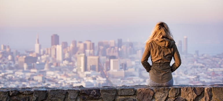 A girl looks at the city of San Francisco