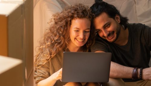 couple looking at their laptop