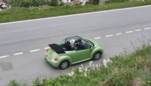 Green car on the road