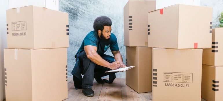 A professional mover that was hired after reading about commercial moving mistakes you'll definitely want to avoid overlooking the boxes
