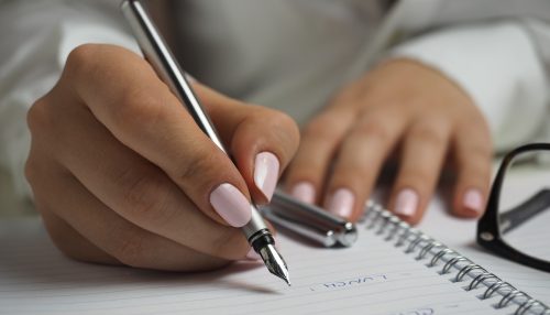 Picture of a person writing