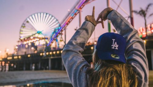 a woman with an LA hat