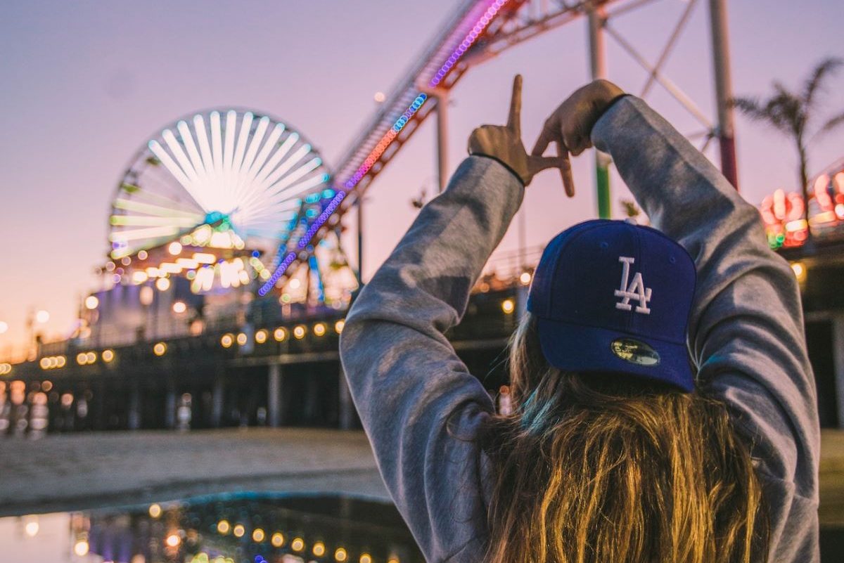 a woman with an LA hat