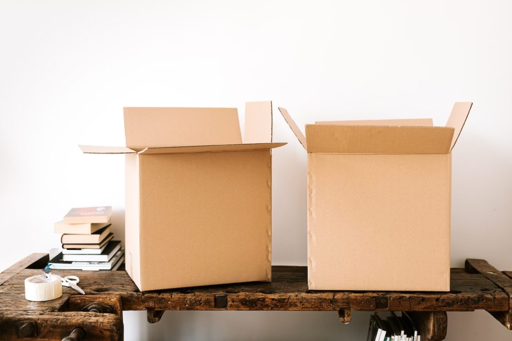 Two moving boxes sitting on a desk