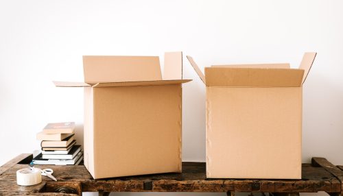 Two moving boxes sitting on a desk